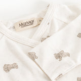 White dress with beige teddy bear print, collar and MarMar Copenhagen brand.
