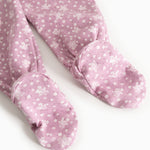 Rubetta dress in pink with small white-pink floral print and feet with fabric cover.