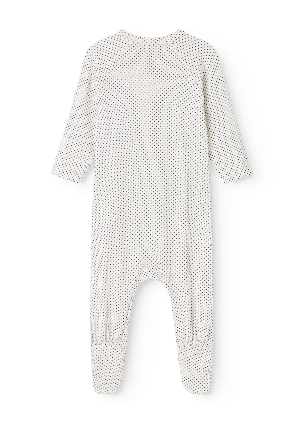White dress with small black dots, long sleeves and a slit.
