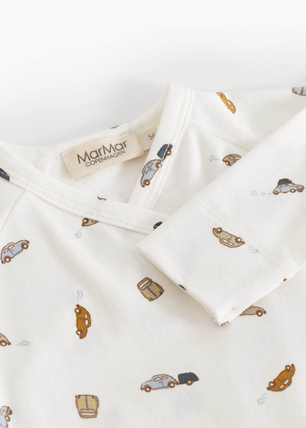 White dress with car print and tag on the neck