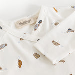 White dress with car print and tag on the neck