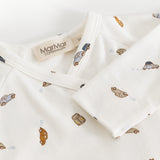 White dress with car print and tag on the neck