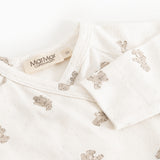 White dress with teddy pattern and button closure at the neck