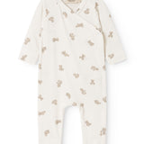 White dress with teddy pattern, cross neckline.