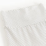Baby tights with small black dots, tight leg cut and seams