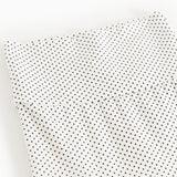Baby tights with small black dots, tight leg cut and seams