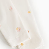 Piva baby pants, close-up of leg opening and seam with pastel animal print