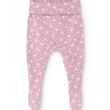 Pink trousers with small white flower print and foot closure.
