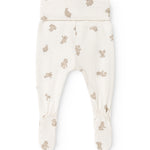 Baby leggings with beige teddy bear print and elastic at the leg opening.