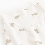 Details of baby pants with repeated teddy bear print
