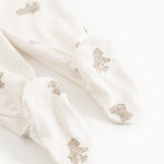 Baby tights with teddy bear print and elastic cuffs at the ankles.