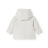 Children's jacket with the back in white with small black dots and hood.