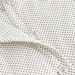 Rexa dress with small black dots, snap closure and white collar