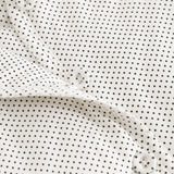 Rexa dress with small black dots, snap closure and white collar