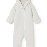 White dress with small black dots, hood and button closure in front.