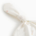 White baby hue with knot and fine rib edge, detail of fabric and patterns.