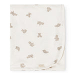 Offwhite rug with teddy bear print and discreet fabric label at the bottom.