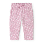 Pink pants for baby with small star flowers and elastic waistband in front.