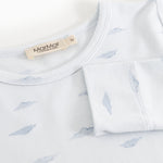 Baby nightgown close: round neck and whale pattern, label on the top.
