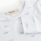 Baby nightgown close: round neck and whale pattern, label on the top.