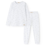 White children's pajamas with long sleeves and trousers, blue whales everywhere.