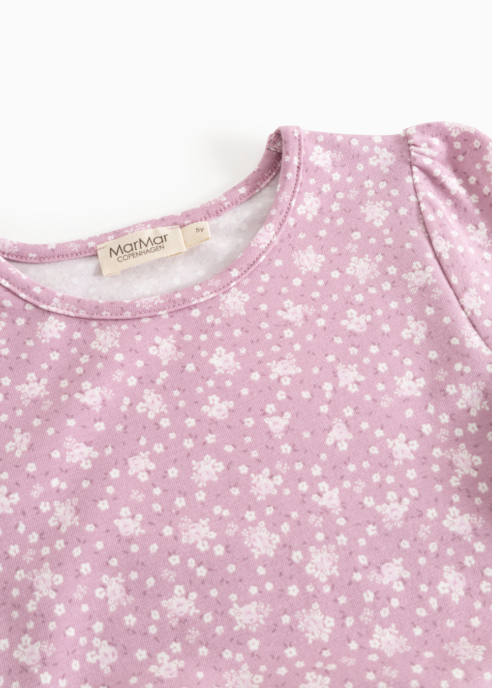 Dress in lilac/pink with small white flowers, round neckline, and brand on the inside.