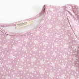Dress in lilac/pink with small white flowers, round neckline, and brand on the inside.