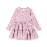 Lilac/pink dress with small white flowers, long sleeves and a ruffled skirt.