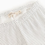Leggings with MarMar brand at the waist and white, fine polka dot pattern.