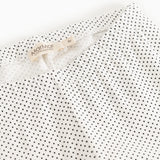 Leggings with MarMar brand at the waist and white, fine polka dot pattern.