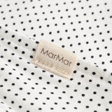 MarMar sweater in white with small black dots, triangular edge and beige label.