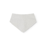 White triangular sanding block with small black dots.