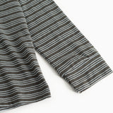 Details: dark gray striped blouse with long sleeves and thin light stripes.