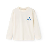 Long-sleeve blouse in cream with a blue "Hello" print on the chest.