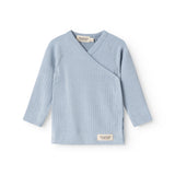 Light blue long-sleeve wrap blouse with V-neck and button closure