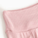 Pink baby pants: ribbed lining and a gentle wave pattern drape at the waist.