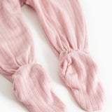 Pink striped baby pants with elastic at the ankles and wide leg opening.