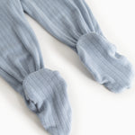 Light blue baby pants in rib knit with elastic at the ankles.