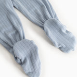 Light blue baby pants in rib knit with elastic at the ankles.