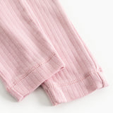 Pink baby shorts with ribbed edge at the bottom and seams.