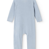Light blue jumpsuit with long sleeves and legs and ribbed texture seen from behind.
