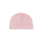 Pink baby hat in rib knit with a small tag on the side