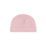 Pink baby hat in rib knit with a small tag on the side