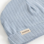 Blue ribbed stripe sweater with beige logo label on cuff.