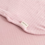 Pink carpet Alida Smoothie with a textured pattern, sewn edge, and label patch