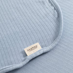 Alida carpet in light blue with ribbed knit, edge stitching and brand label in the corner