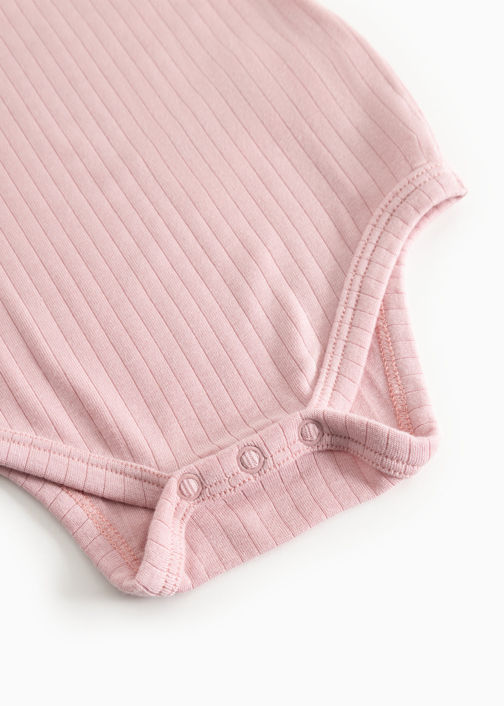 Pink, knitted long-sleeve bodystocking with snap-button closure at the leg openings.