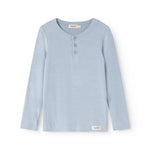 Light blue long-sleeve T‑shirt with front button closure and small round neckline.