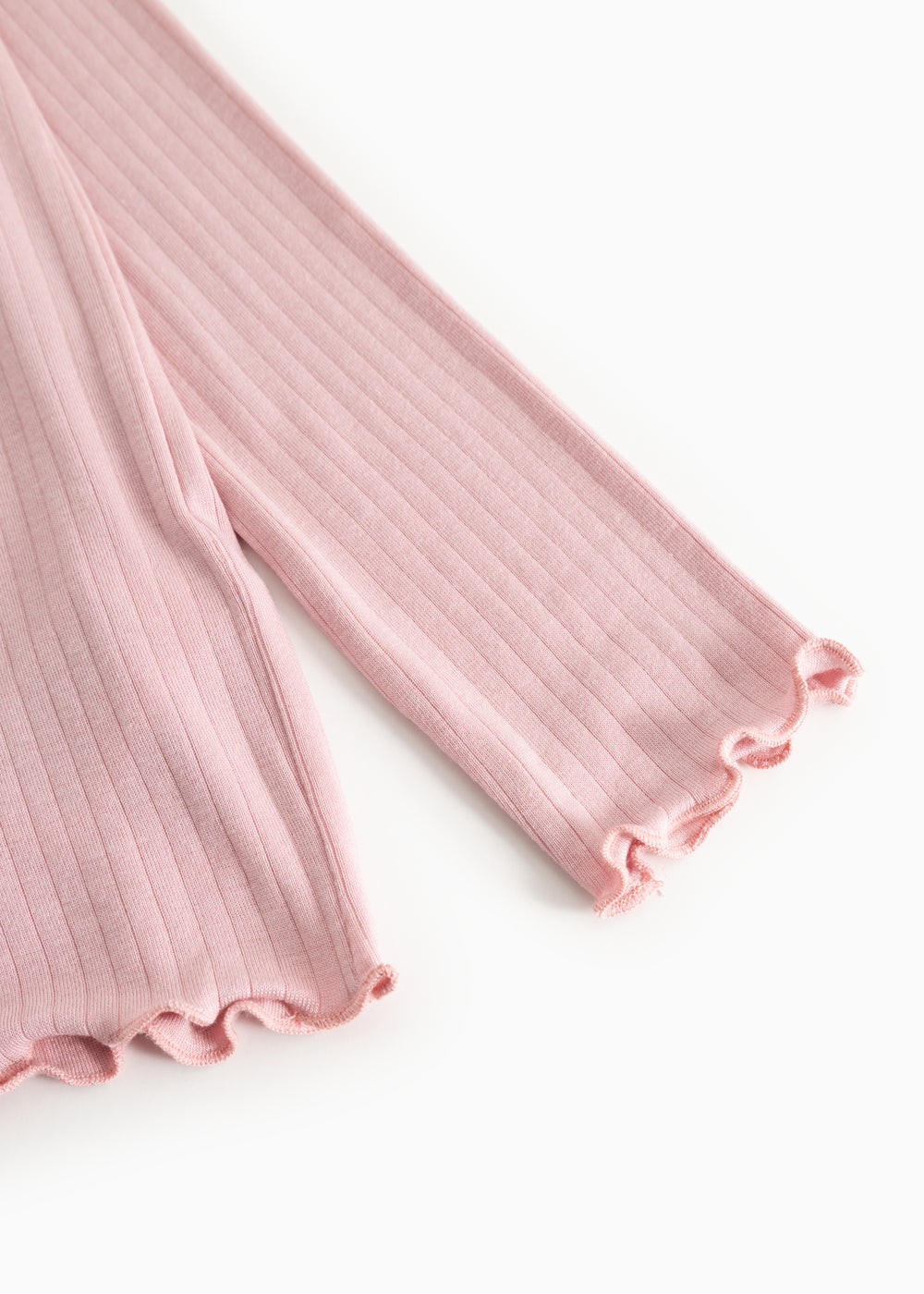 Pink ribbed long-sleeve T-shirt with a creased edge at the sleeve.