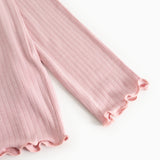 Pink ribbed long-sleeve T-shirt with a creased edge at the sleeve.